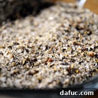 Close-up of Homemade Lemon Pepper Seasoning in a small jar.