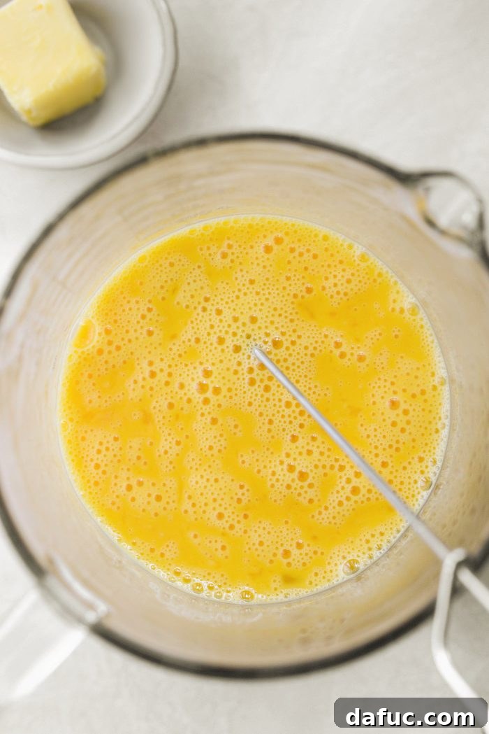 Whipping eggs in a bowl with a whisk