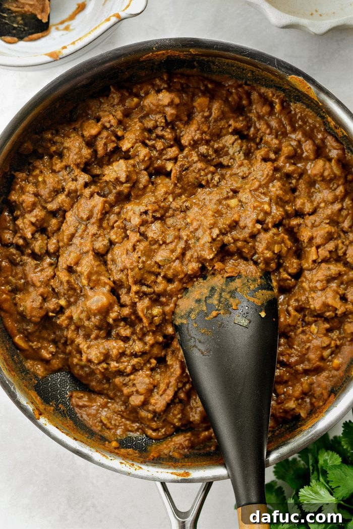 Ultimate Beef and Bean Nachos 11 stir, adding more water as needed