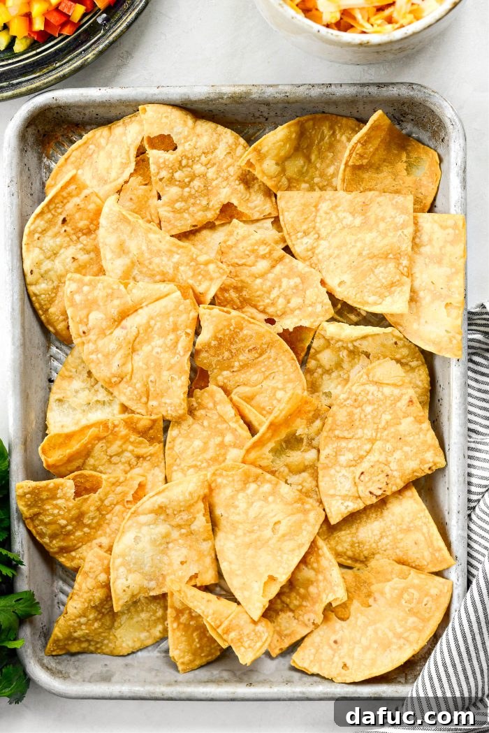 Ultimate Beef and Bean Nachos 12 add chips to pan