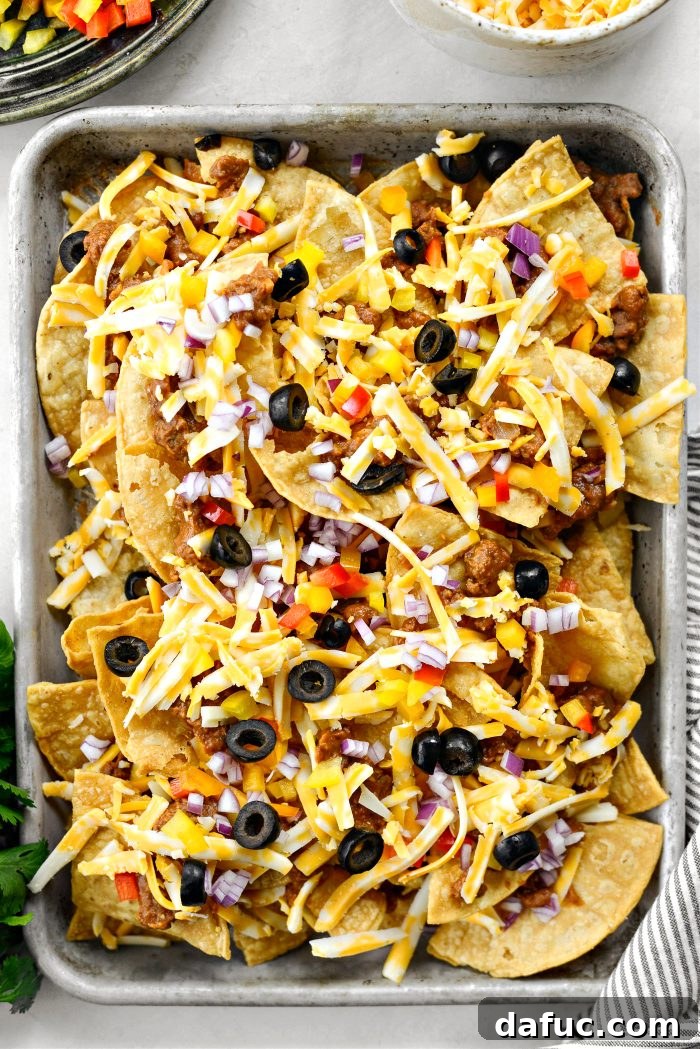 Ultimate Beef and Bean Nachos 14 add a second layer of chips, beef and beans, cheese, red onions, peppers and olives