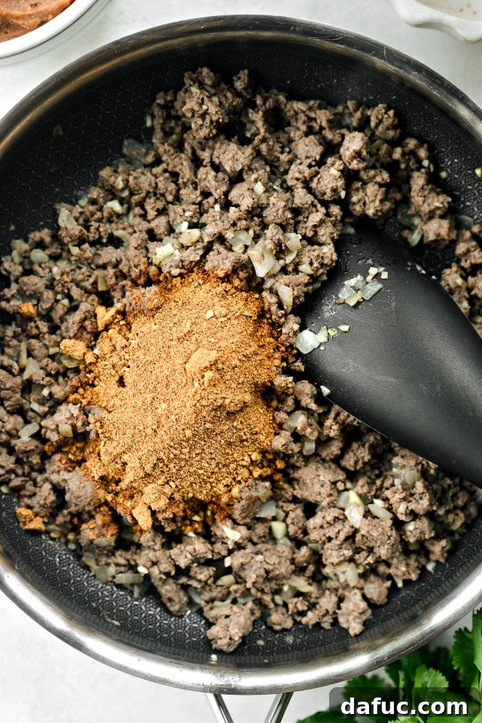 Ultimate Beef and Bean Nachos 8 once cooked add taco seasoning