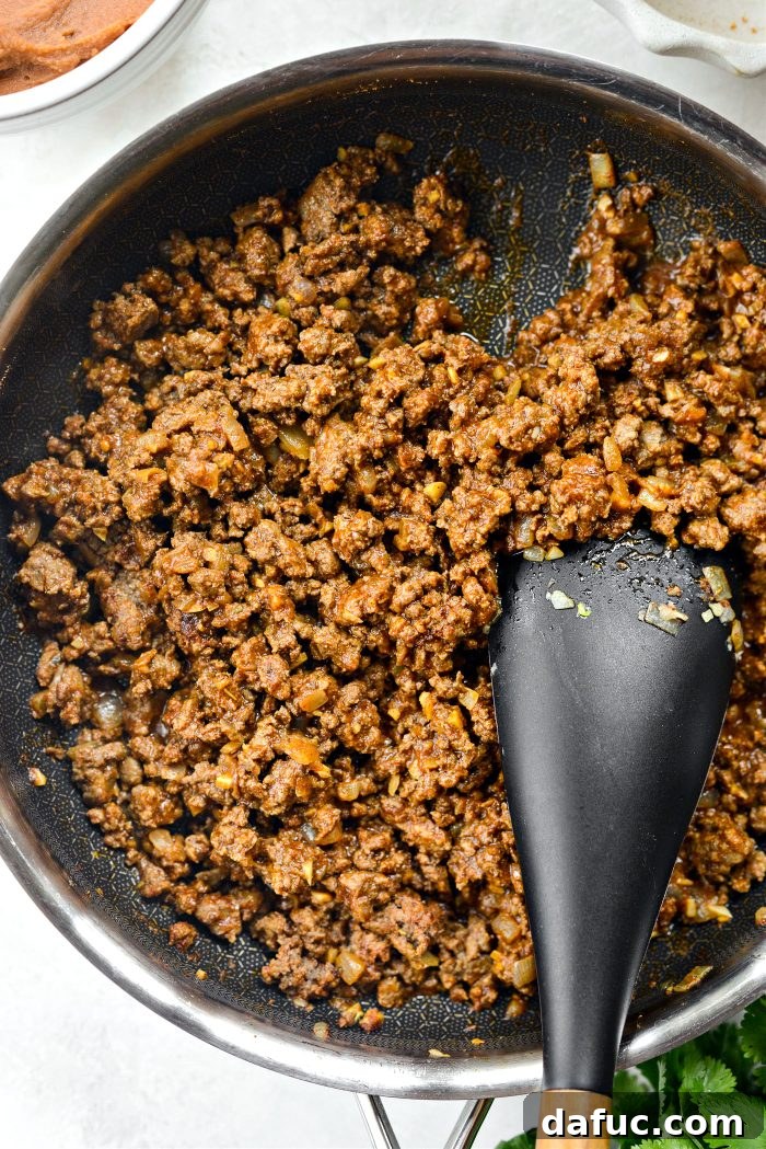 Ultimate Beef and Bean Nachos 9 stir, add water and simmer until thickened
