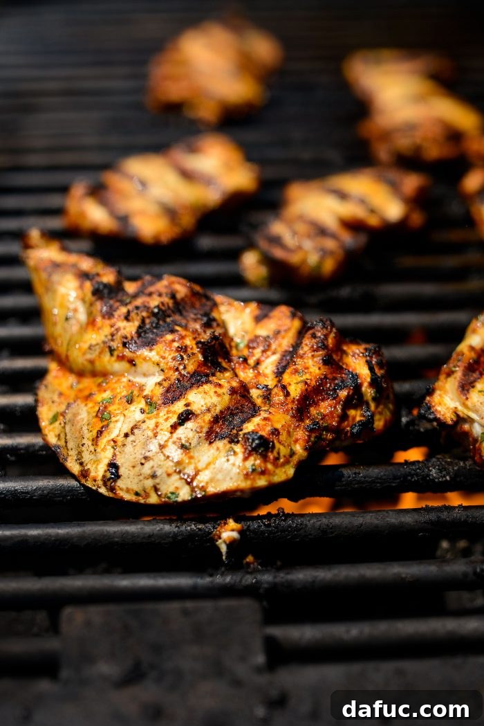 Smoky Chicken Elote Bowls 14 Grilling chicken on a hot grill