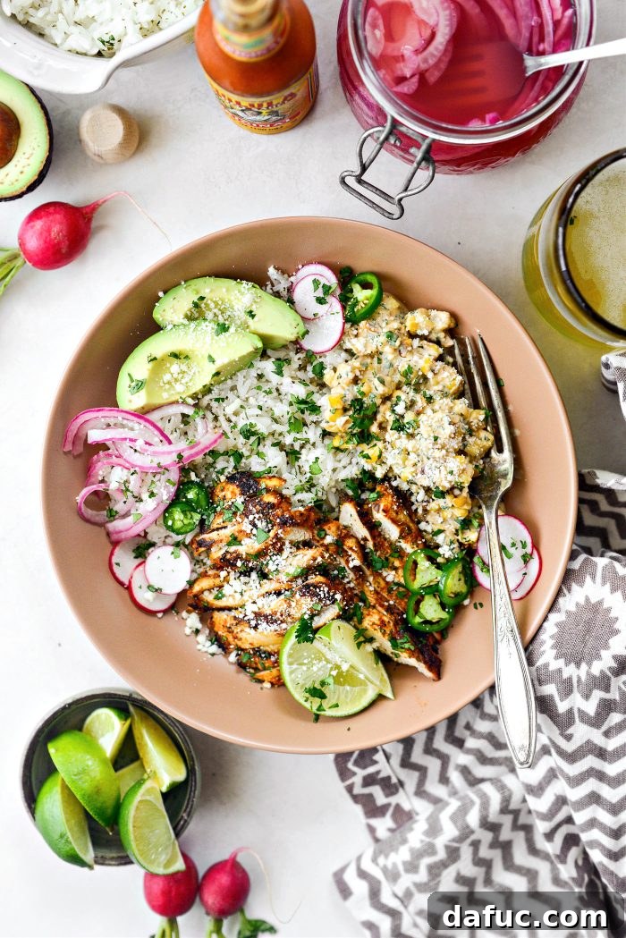 Smoky Chicken Elote Bowls 16 Assembling Grilled Chicken Mexican Street Corn Bowls with rice, chicken, salsa, and toppings