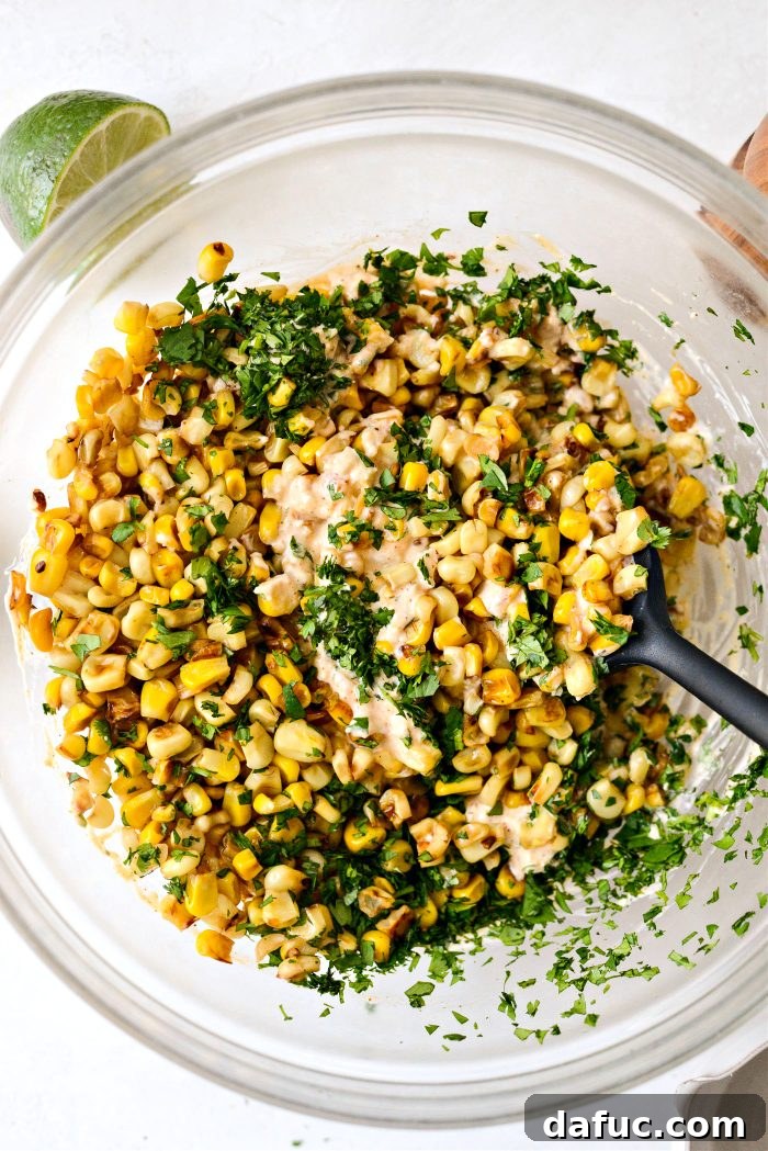 Smoky Chicken Elote Bowls 9 Adding charred corn and cilantro to the mixed salsa base