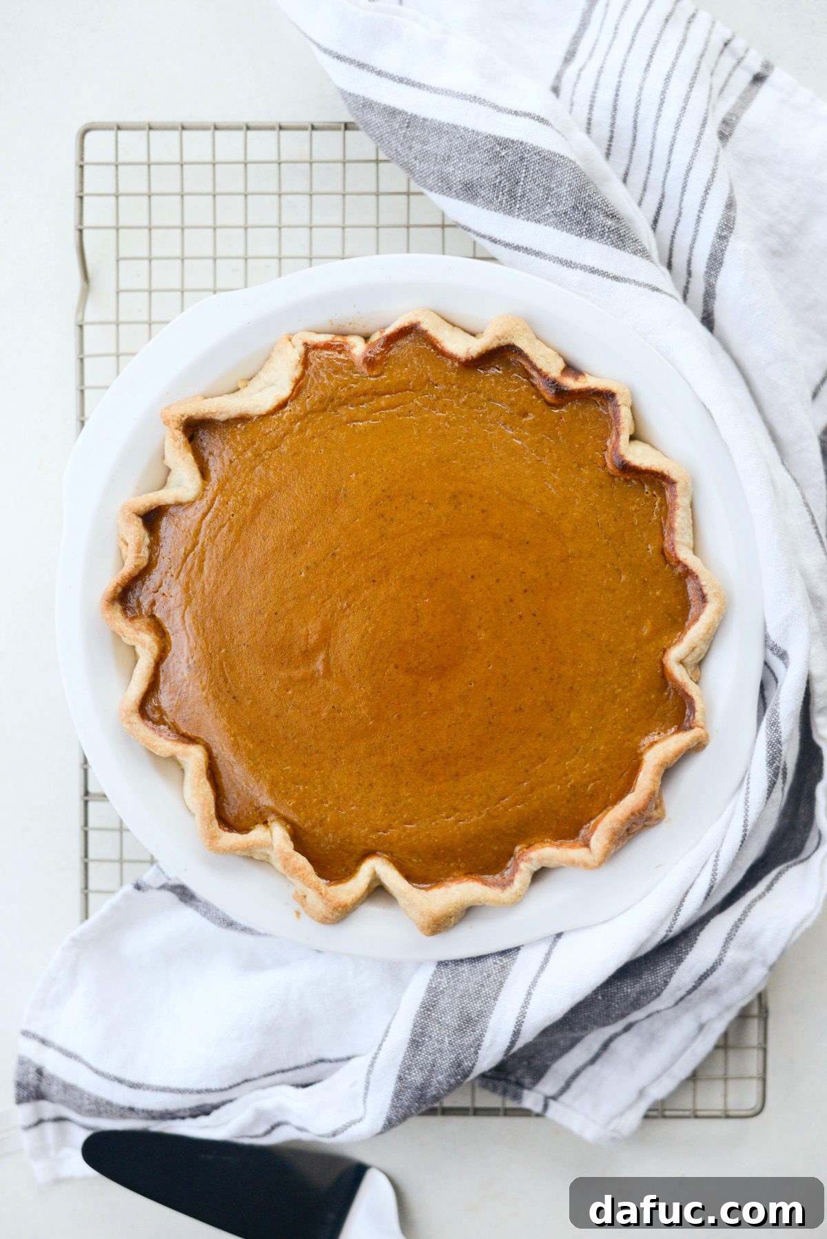 A perfectly baked Classic Pumpkin Pie, golden and ready to cool
