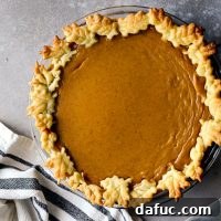 Classic Pumpkin Pie with a slice removed