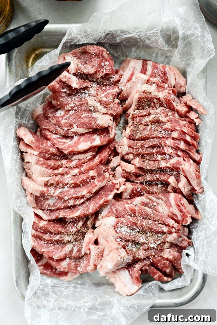 Spicy-Sweet Crispy Beef and Snap Peas 8 Seasoned steak strips glistening in a bowl, perfectly coated with kosher salt and black pepper.