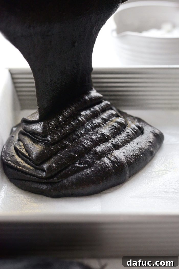 pour brownie batter into prepared pan
