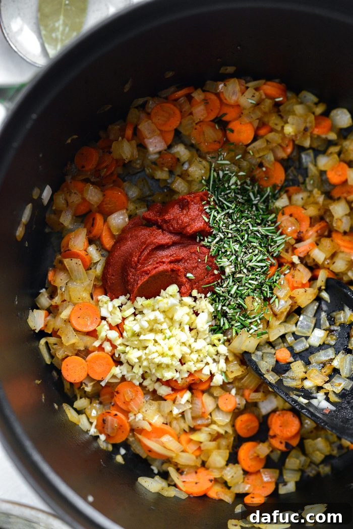 add tomato paste, garlic and rosemary to veggies