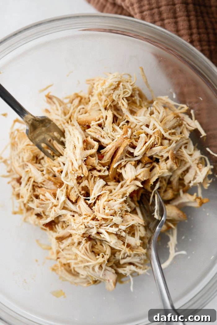 Removing and shredding chicken breasts for chili