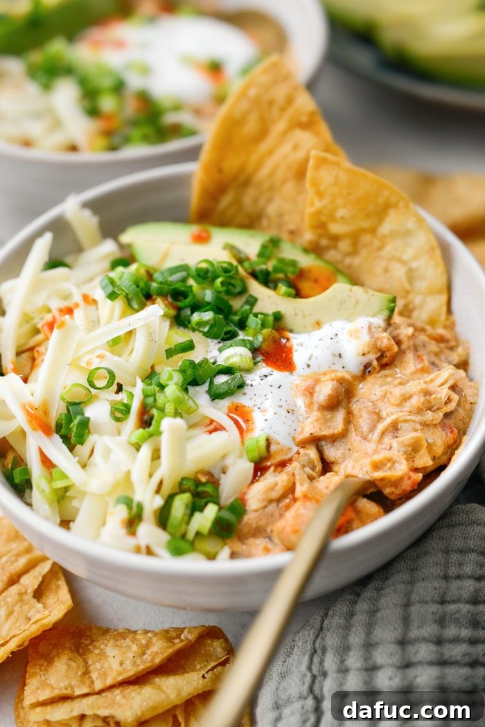 Serving homemade Slow Cooker Buffalo Chicken Chili in bowls