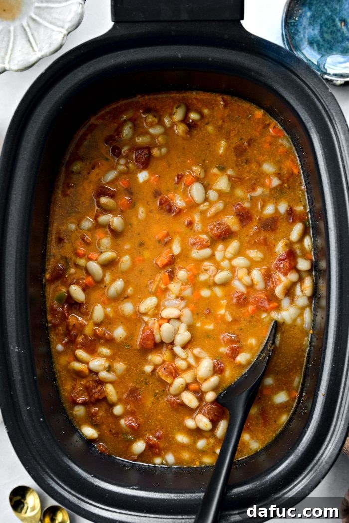 Stirring to combine all ingredients in the slow cooker