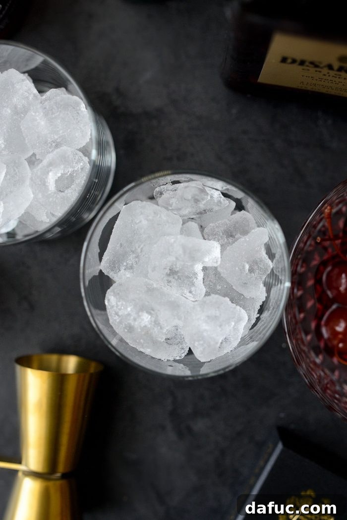 Spiced Amaretto Elixir 5 Filling a rocks glass with ice