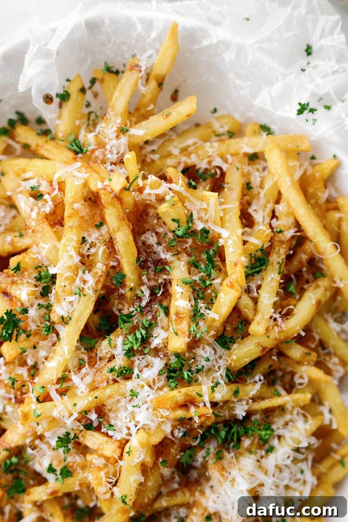 Decadent Truffle Parmesan Fries 15 A close-up of a single Parmesan Truffle Fry, perfectly crisp and seasoned