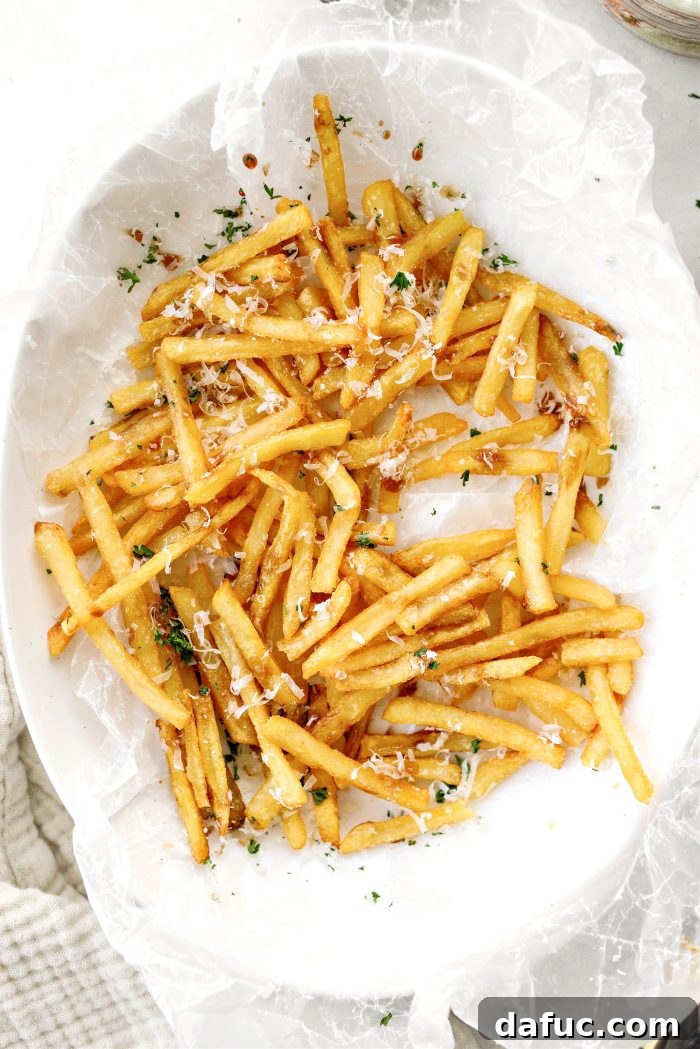 Decadent Truffle Parmesan Fries 16 A final artistic shot of Parmesan Truffle Fries artfully arranged and garnished