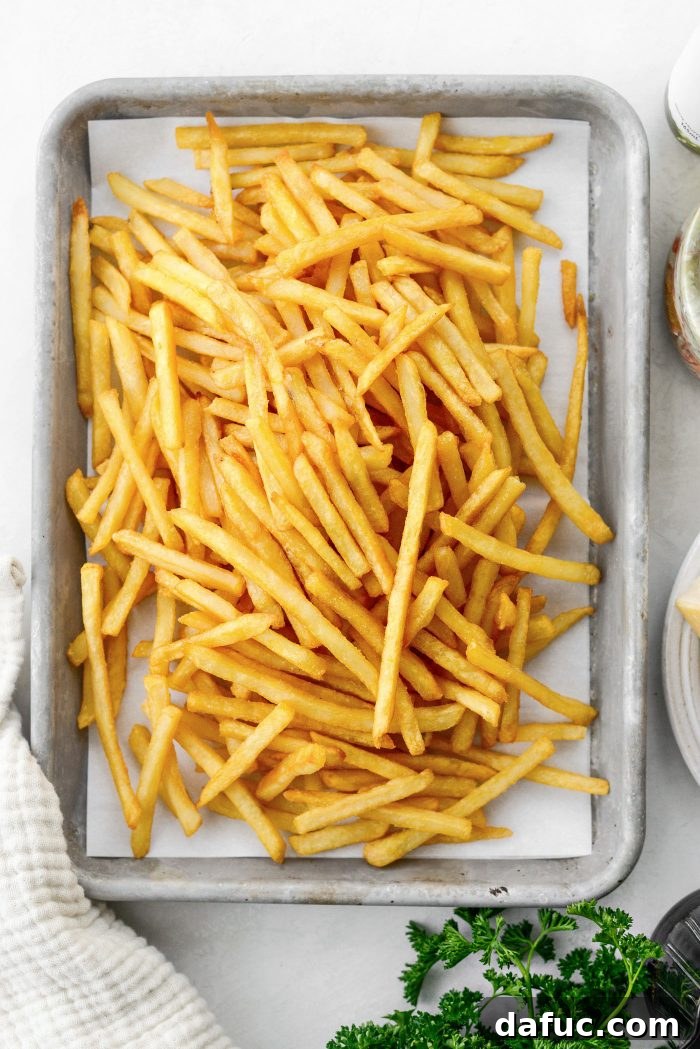 Decadent Truffle Parmesan Fries 5 Close-up of shoestring French fries ready for baking