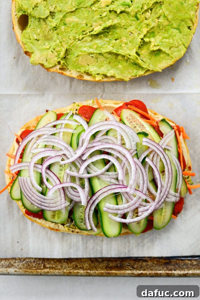 Vibrant Rainbow Stack 13 Layering cucumber ribbons and red onion on top