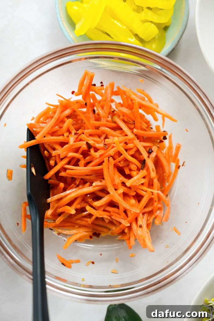Vibrant Rainbow Stack 7 Adding matchstick carrots to the pickling liquid and tossing