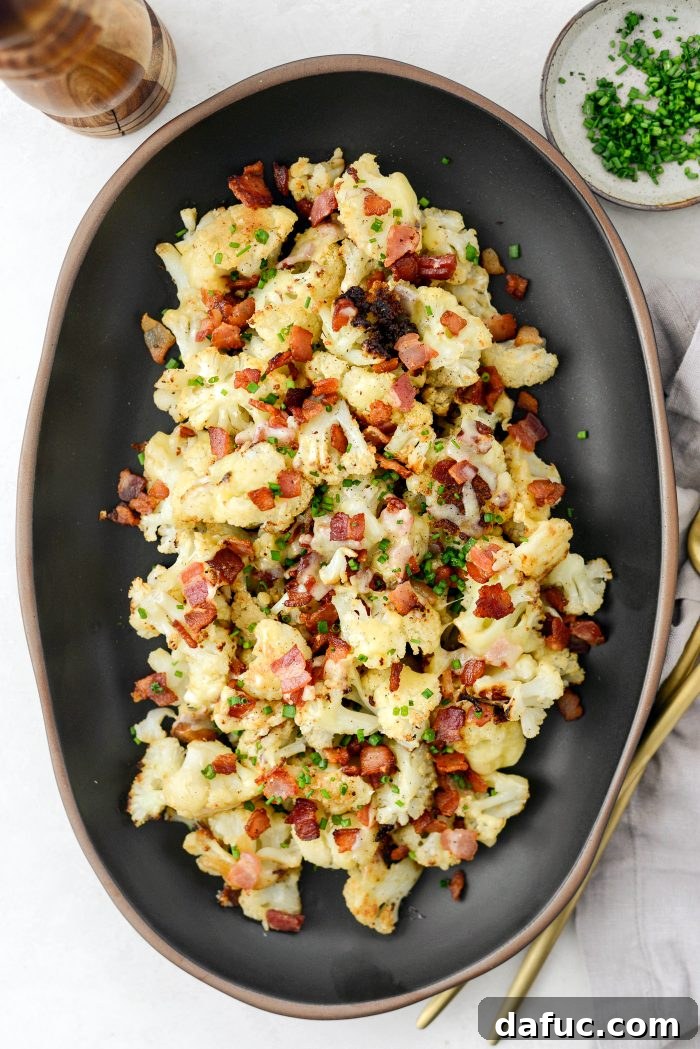 Crispy Bacon & Cheddar Roasted Cauliflower 15 Freshly garnished Roasted Cheddar Cauliflower with Bacon in a serving dish