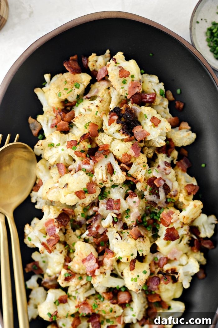 Crispy Bacon & Cheddar Roasted Cauliflower 16 Overhead view of a prepared dish of Roasted Cheddar Cauliflower with Bacon