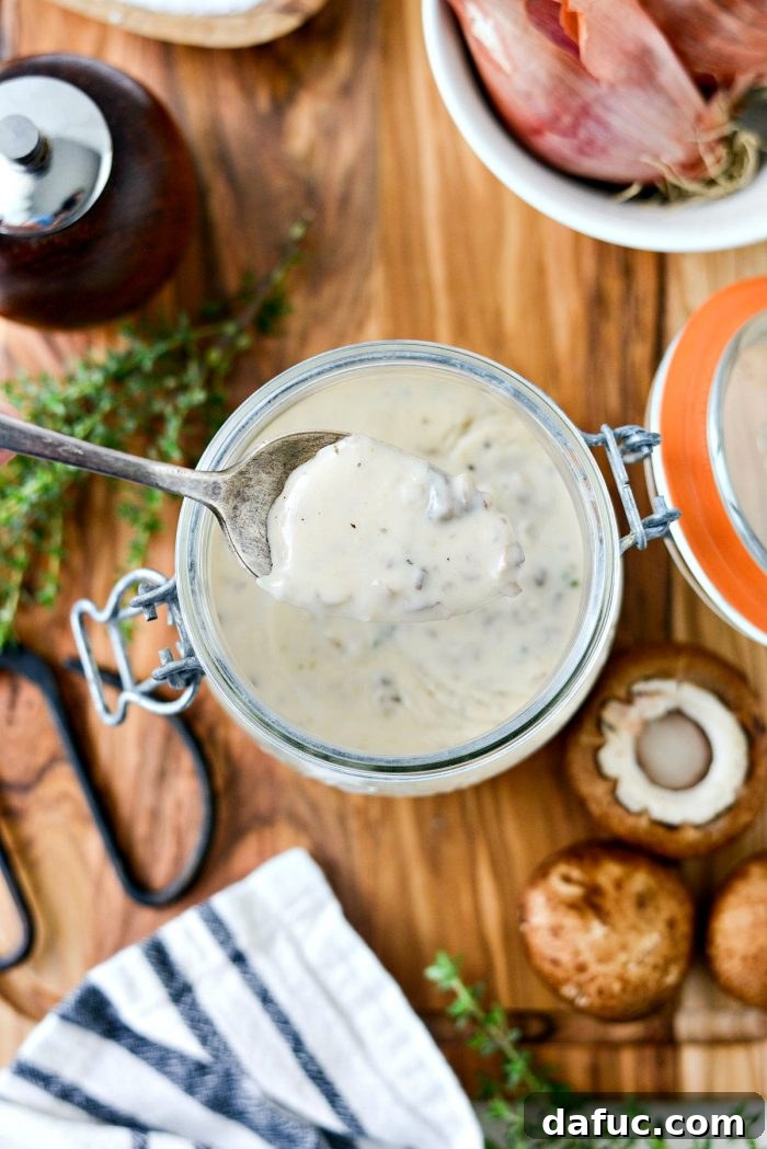 Close-up of the rich and creamy texture of homemade condensed mushroom soup, ready to be used.