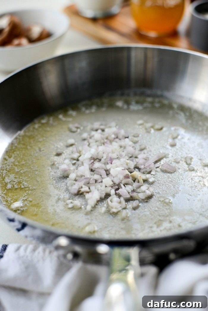 Sautéing finely minced shallots in melted butter until soft and fragrant.