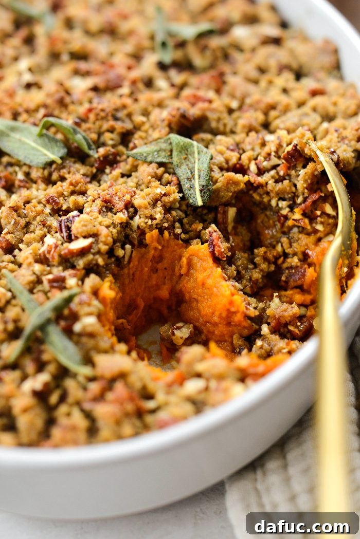 Close-up of a serving of Maple Bourbon Bacon Sweet Potato Casserole, showing texture