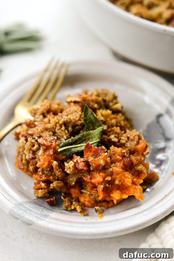 Beautifully plated Maple Bourbon Bacon Sweet Potato Casserole ready for a meal