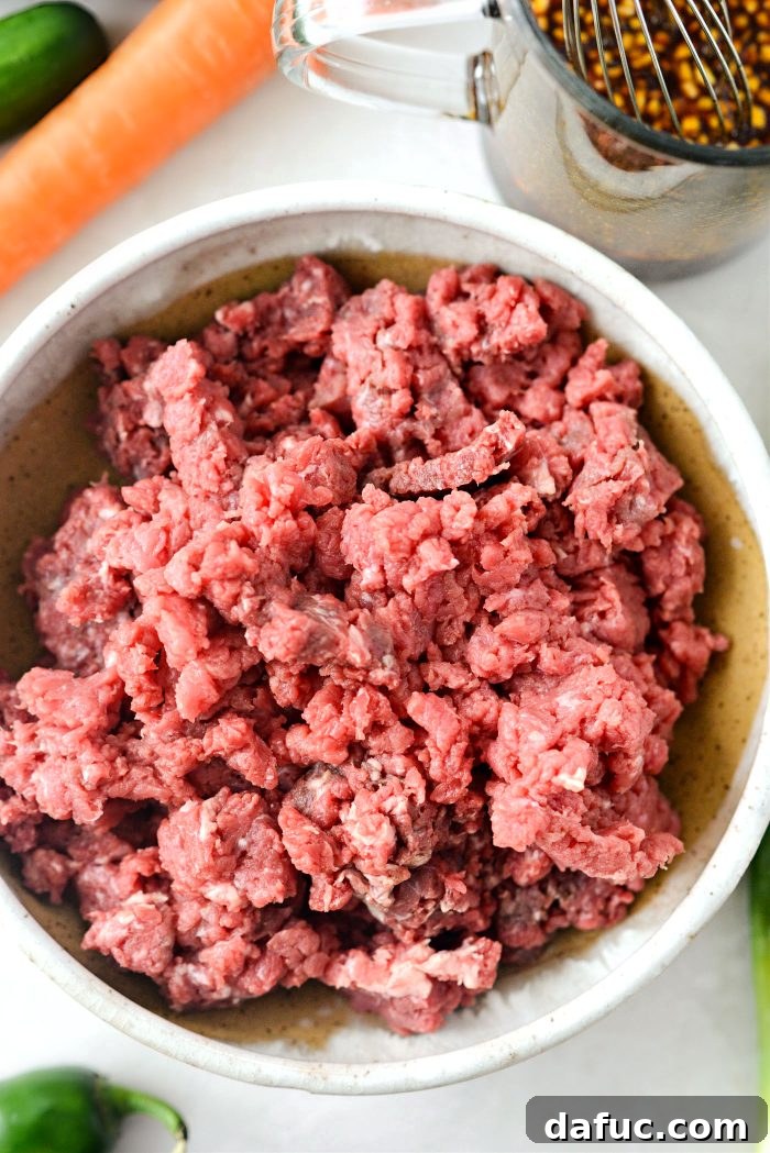 Spicy Sriracha Steak Lettuce Cups 8 Finely chopped cube steak ready for cooking