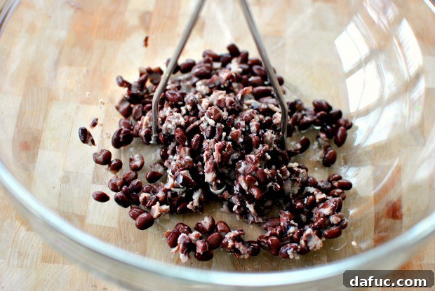 Mashing black beans