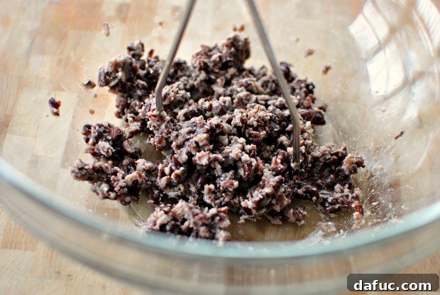 Mashed black beans in a bowl
