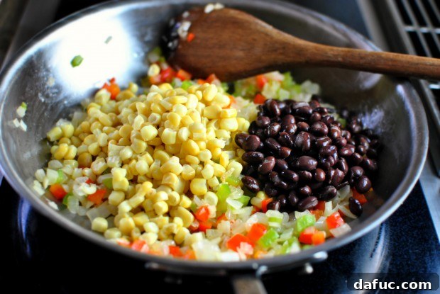 Adding corn and reserved black beans