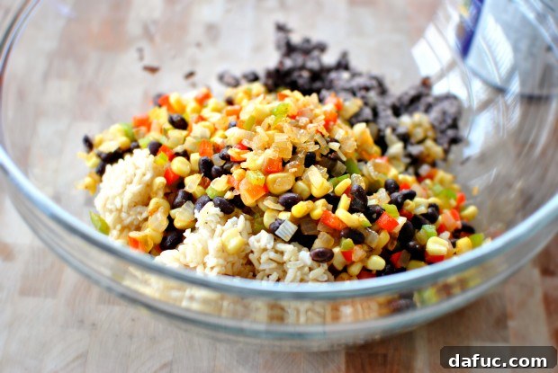 Combining cooled vegetables with beans and rice