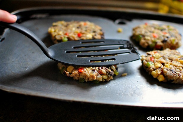 Gently pressing veggie burger patties