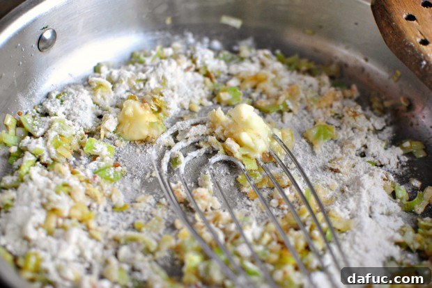 Silky Pancetta, Leek, and Sweet Pea Mac & Cheese 13 Whisking butter and flour into leeks and garlic