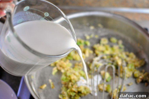 Silky Pancetta, Leek, and Sweet Pea Mac & Cheese 15 Pouring in broth and half & half