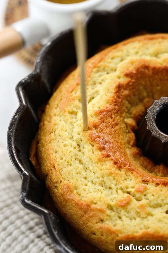 Golden Butter Drenched Cake 13 Poking holes in the warm Kentucky Butter Cake