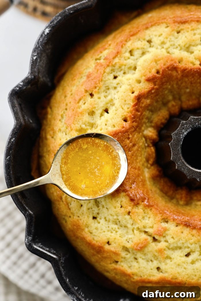 Golden Butter Drenched Cake 14 Spoon-glazing the cake with vanilla sugar glaze