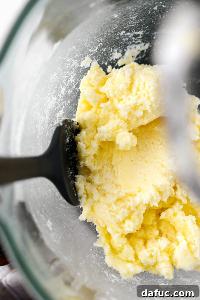 Golden Butter Drenched Cake 8 Scraping the sides of the mixer bowl