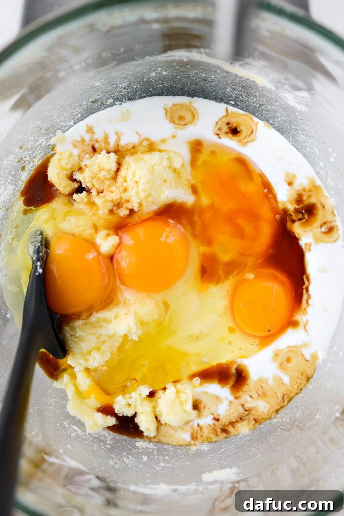 Golden Butter Drenched Cake 9 Adding buttermilk, eggs, and vanilla extract to the mixture