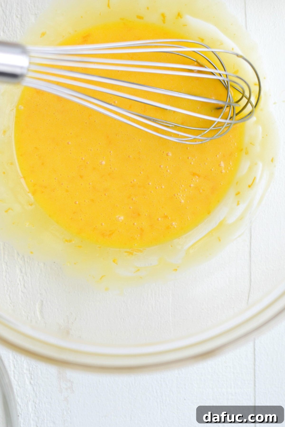 Whisking lemon juice into egg mixture