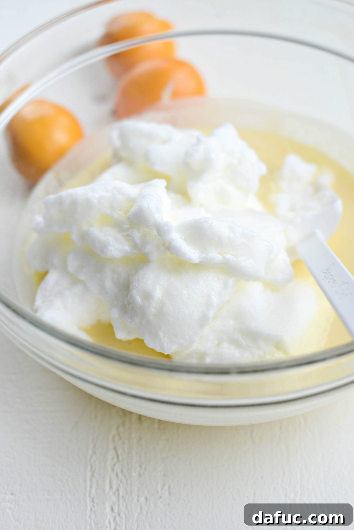 Adding whipped egg whites to the lemon batter