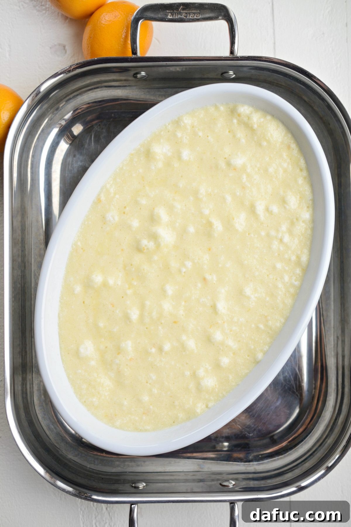 Place baking dish in deep sided pan (like a roasting pan) and fill with hot water