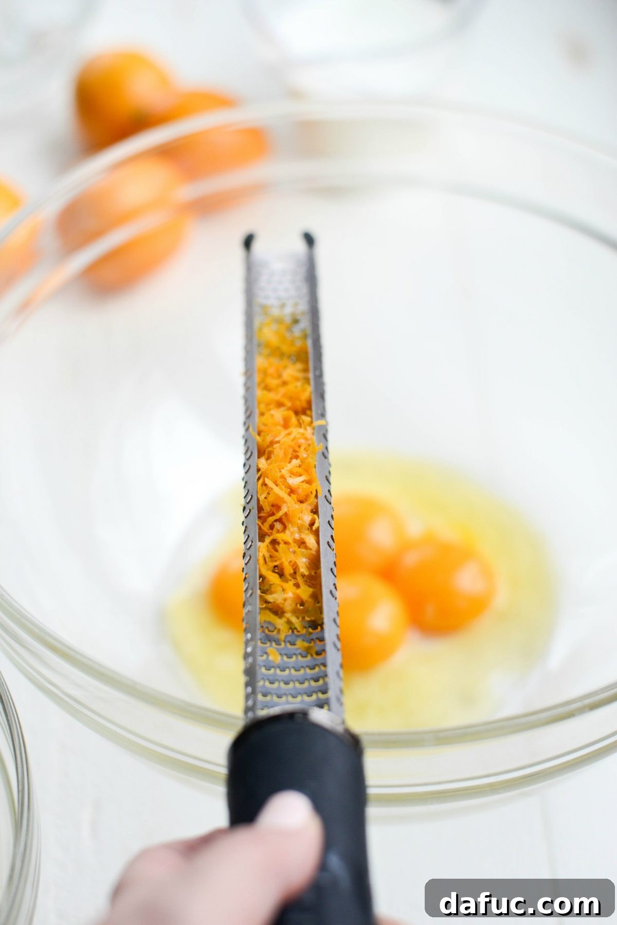 Grate Meyer lemon zest into a bowl