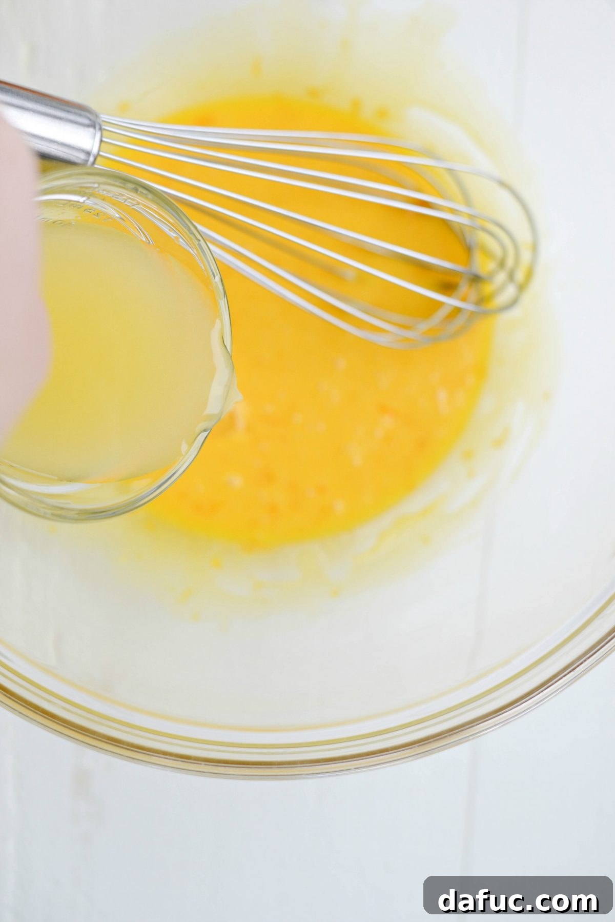 Adding lemon juice to egg mixture
