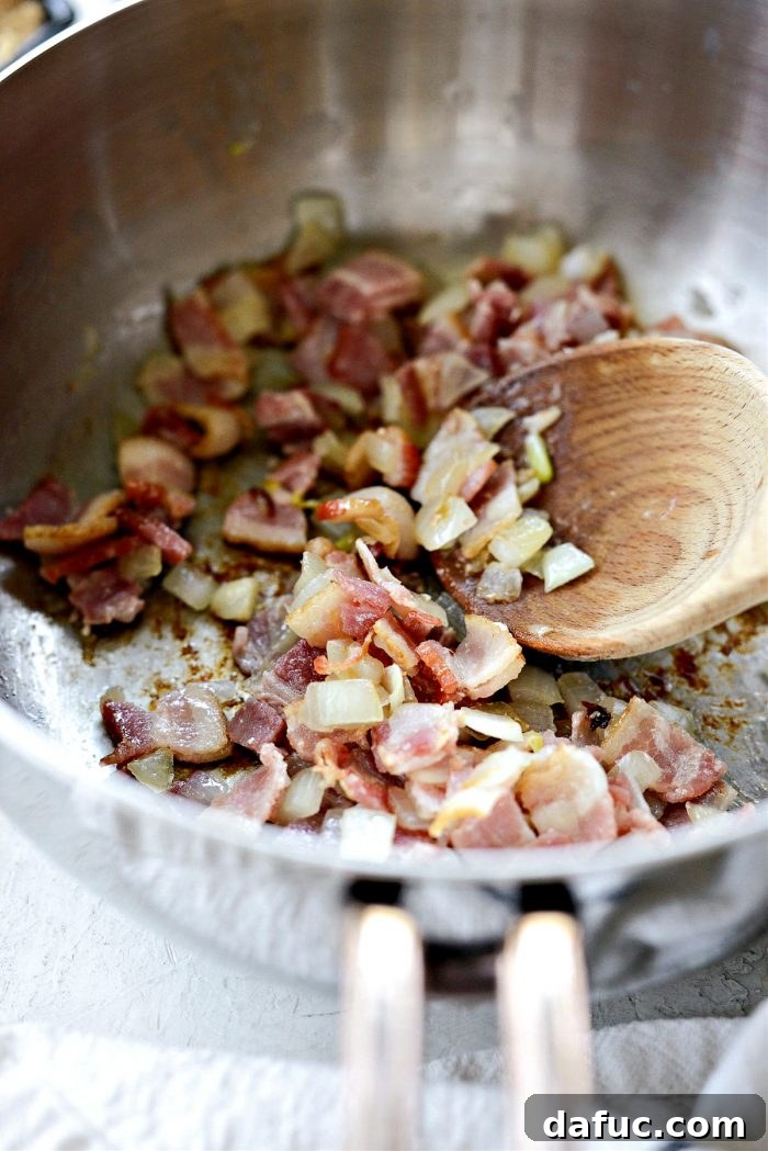 Hearty Homestyle Baked Beans 6 Cooked bacon and soft, translucent onions in a pot