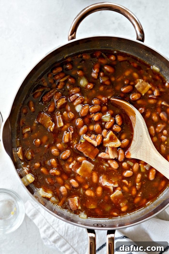 Hearty Homestyle Baked Beans 8 Stirring all ingredients for baked beans together in a pot