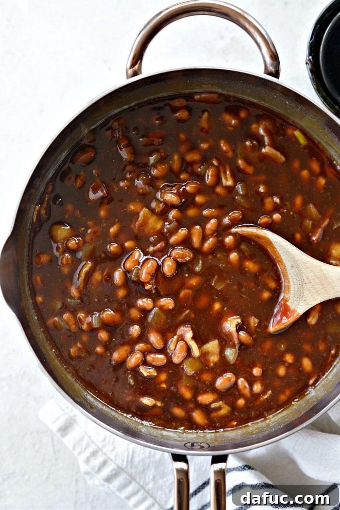 Hearty Homestyle Baked Beans 10 Baked beans uncovered in the oven, stirring recommended